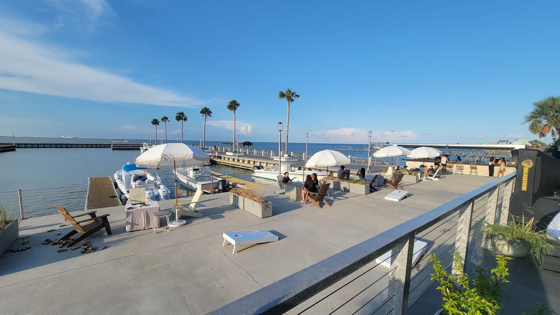 Waterfront deck and boats on Galveston Bay at Pier 6 in San Leon, Texas