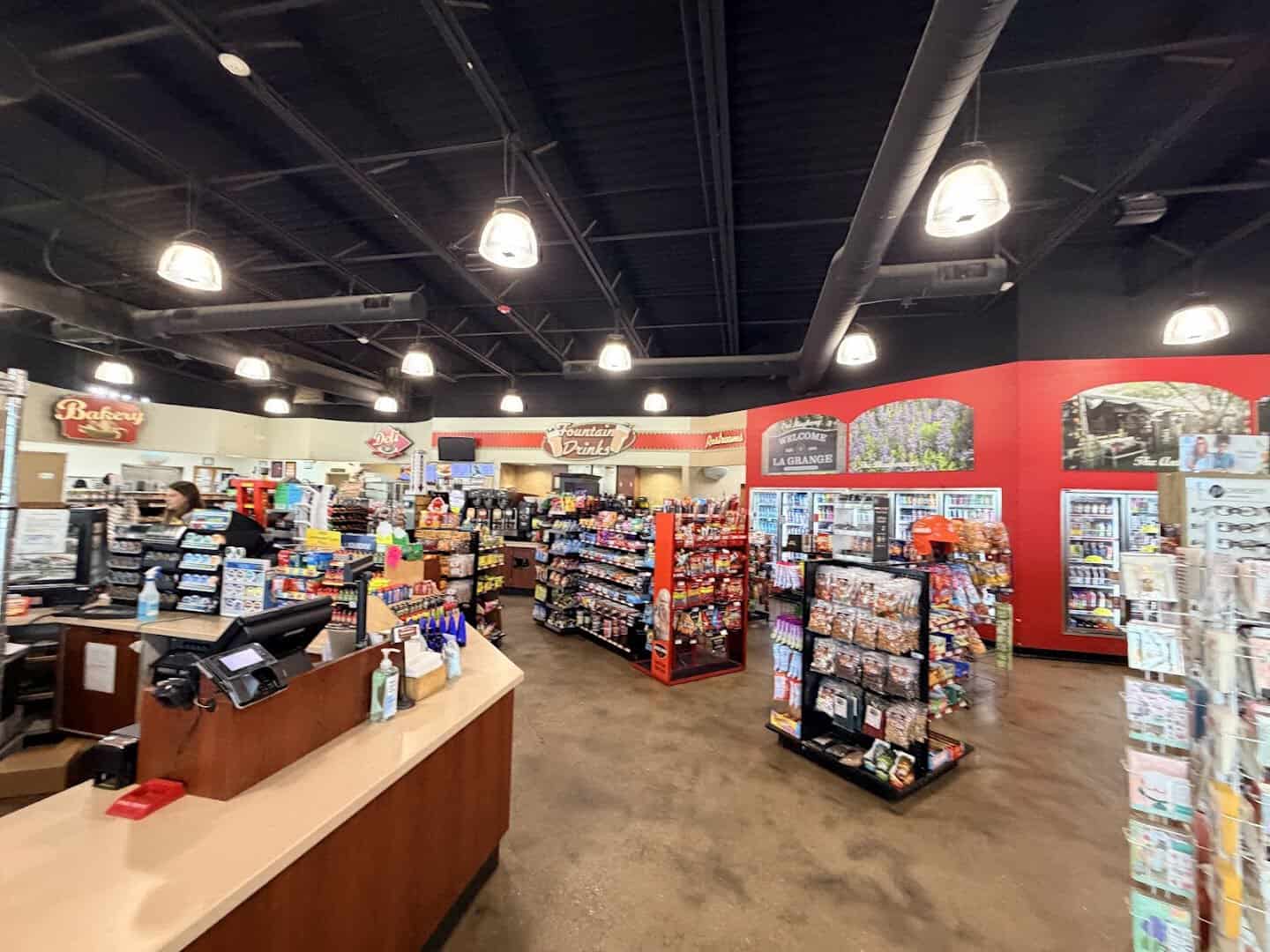 Inside Weikel's Store and Bakery with a Welcome to La Grange sign in Texas