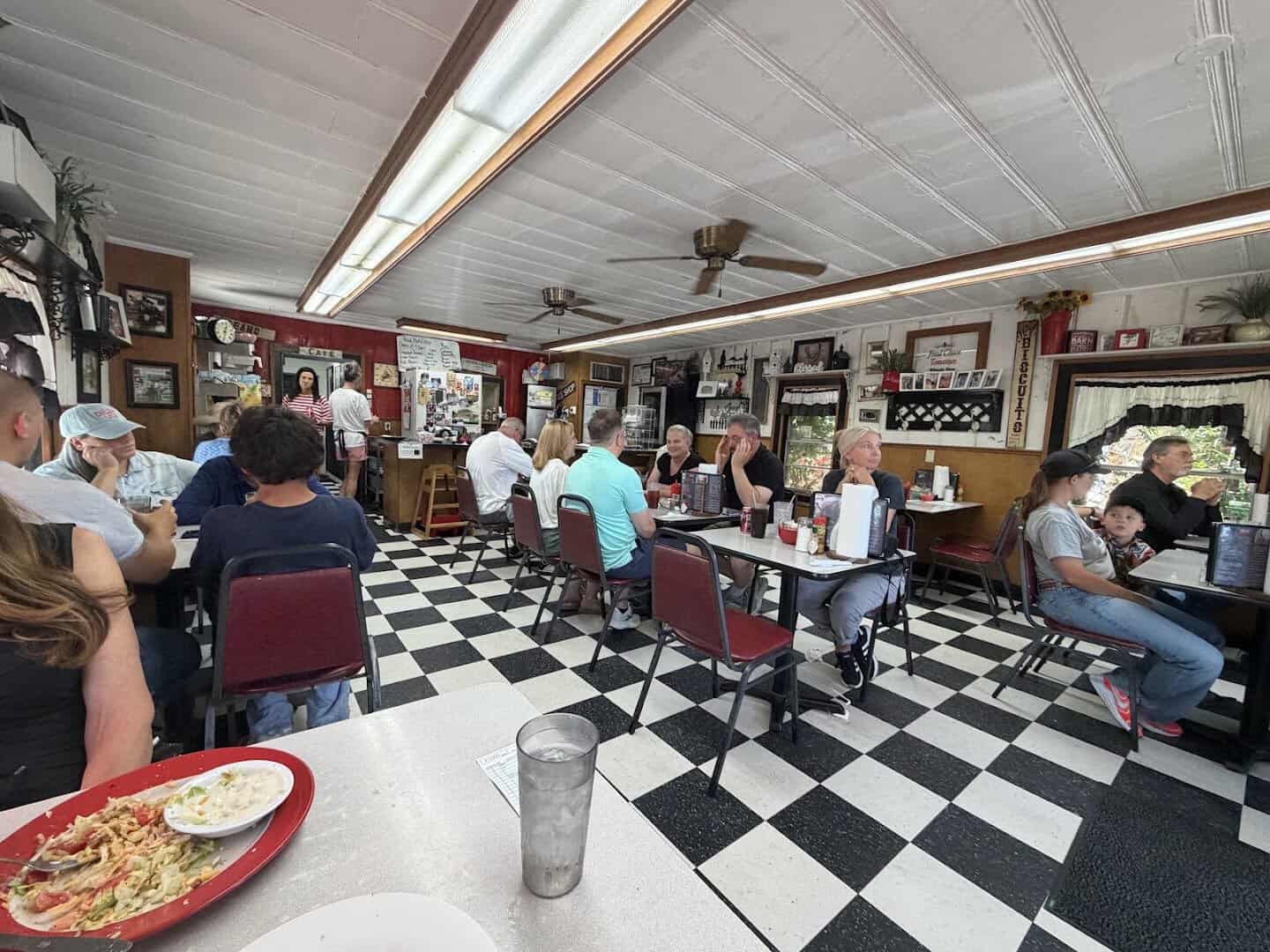 Dining room with checkerboard floor inside Whistle Stop Cafe in Decatur, Texas
