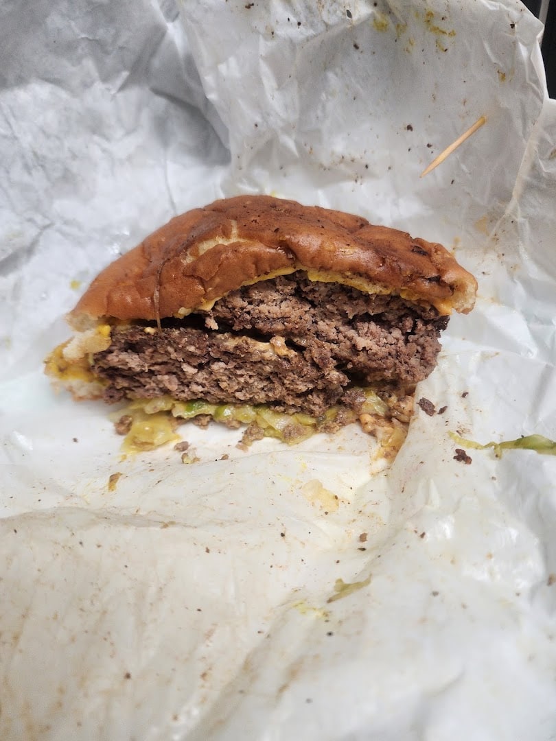 Cross-section of a double patty burger showing crusty edges at Wingfield's in Dallas