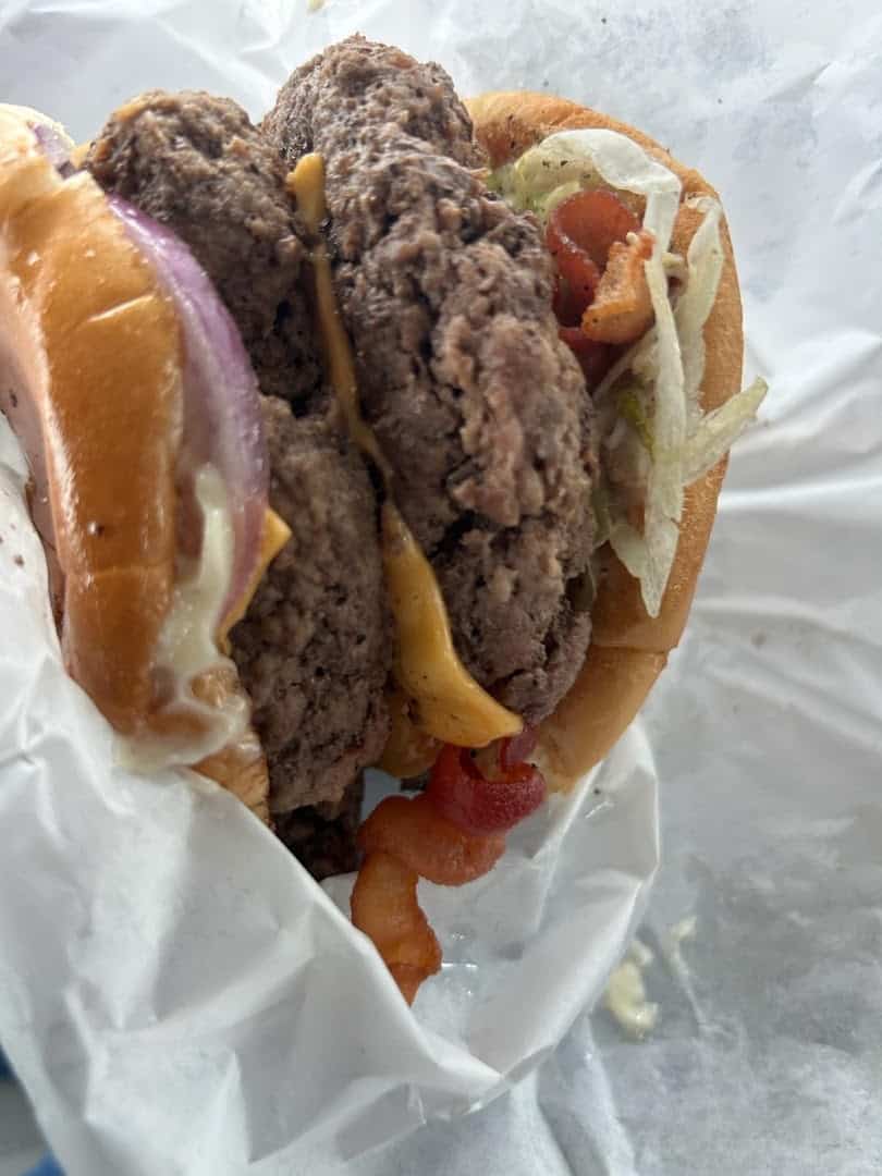 Double patty cheeseburger with crispy edges at Wingfield's in Dallas