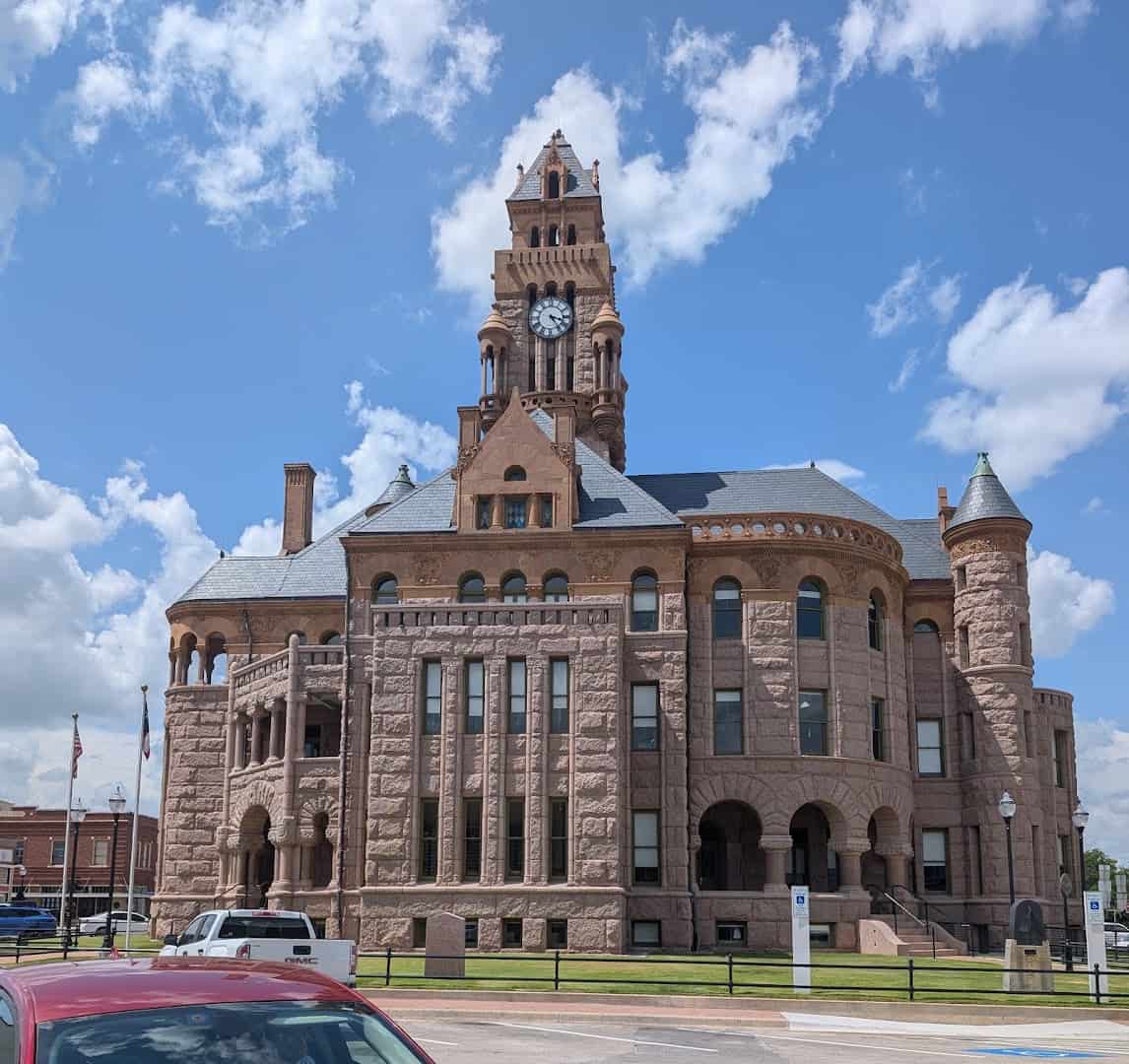 The full facade of the Wise County Courthouse under a blue sky