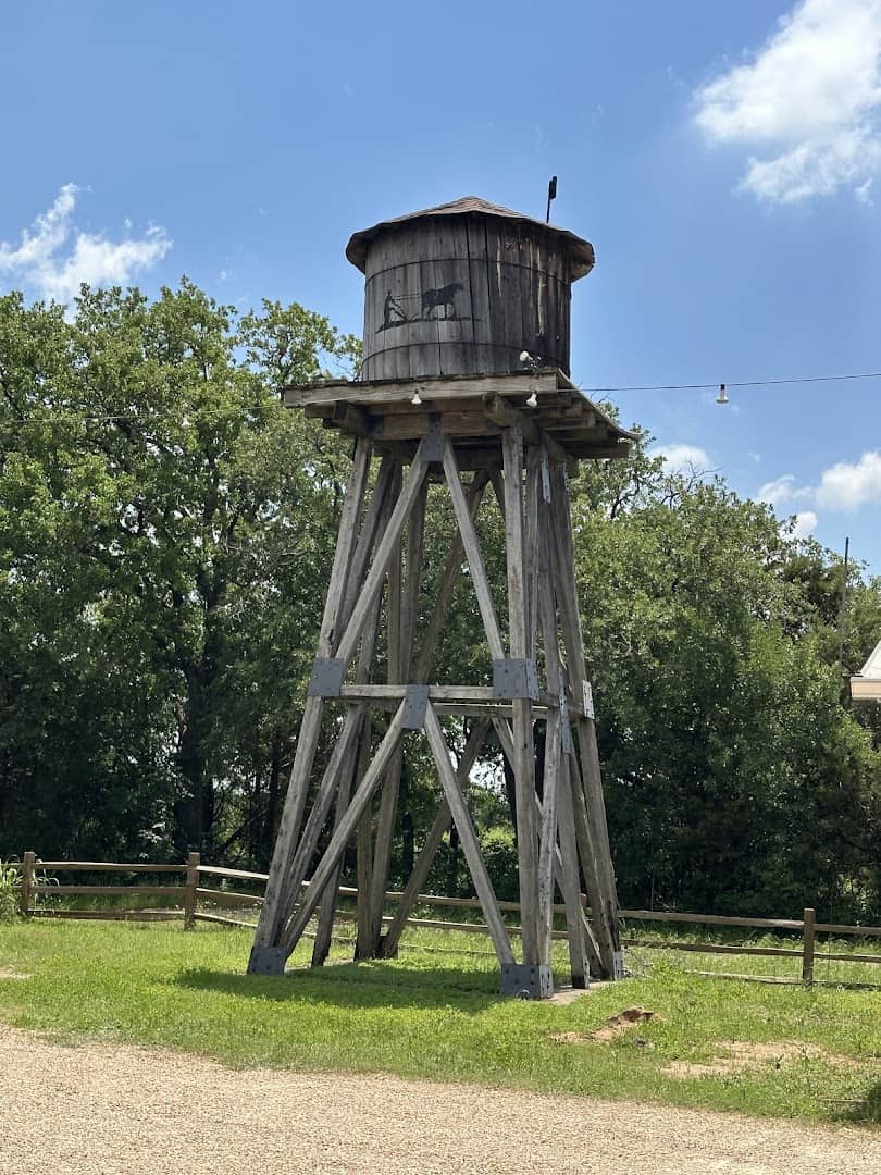 Rustic wooden water tower at Homestead Heritage near Waco, Texas