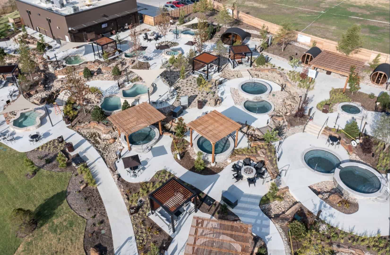 Aerial view of dozens of mineral soaking pools at WorldSprings in The Colony, Texas
