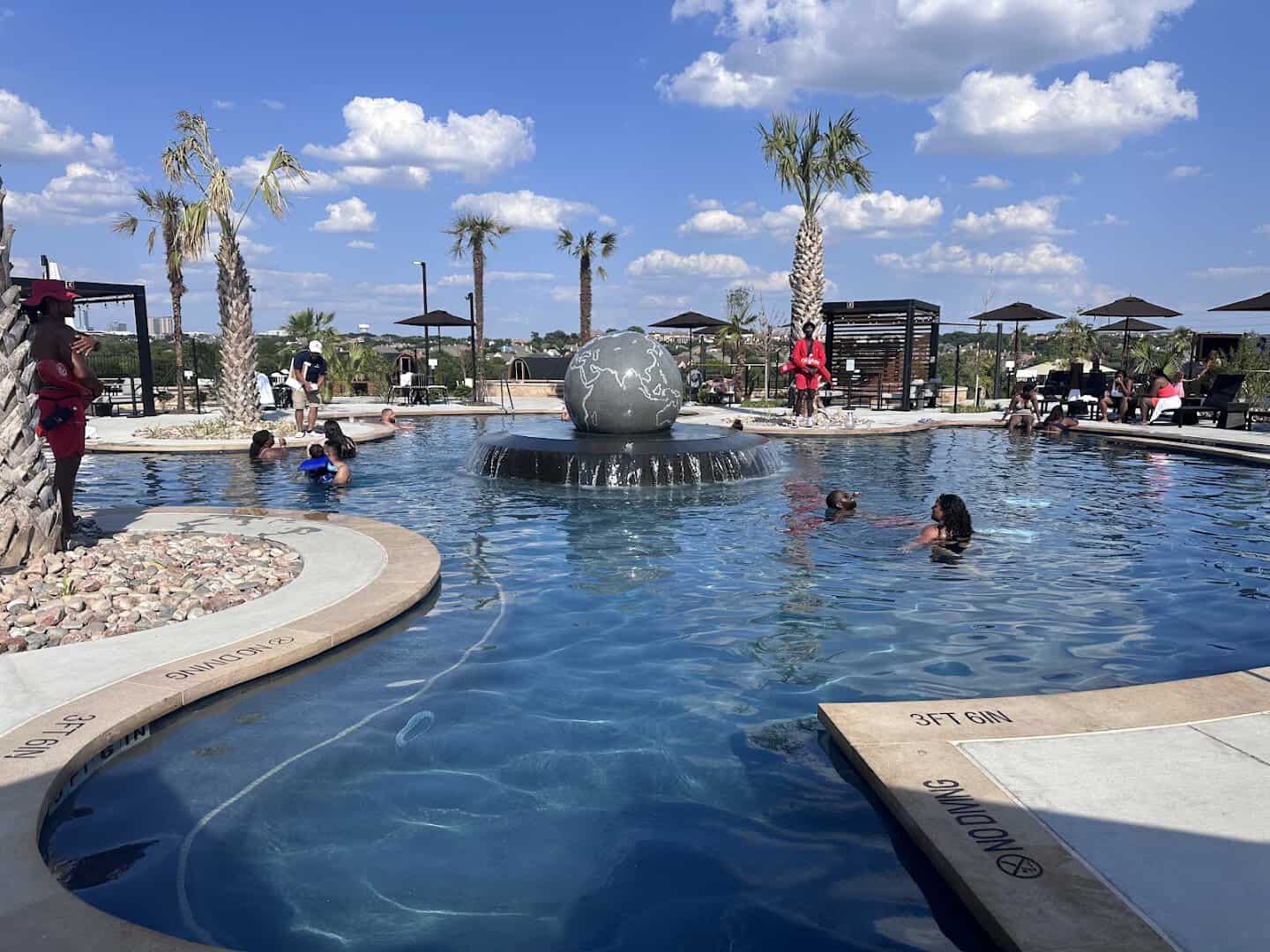 Large mineral soaking pool with a fountain at WorldSprings in The Colony, Texas