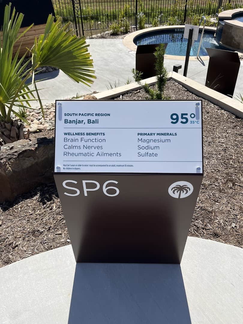 Pool sign listing temperature and minerals at WorldSprings in The Colony, Texas