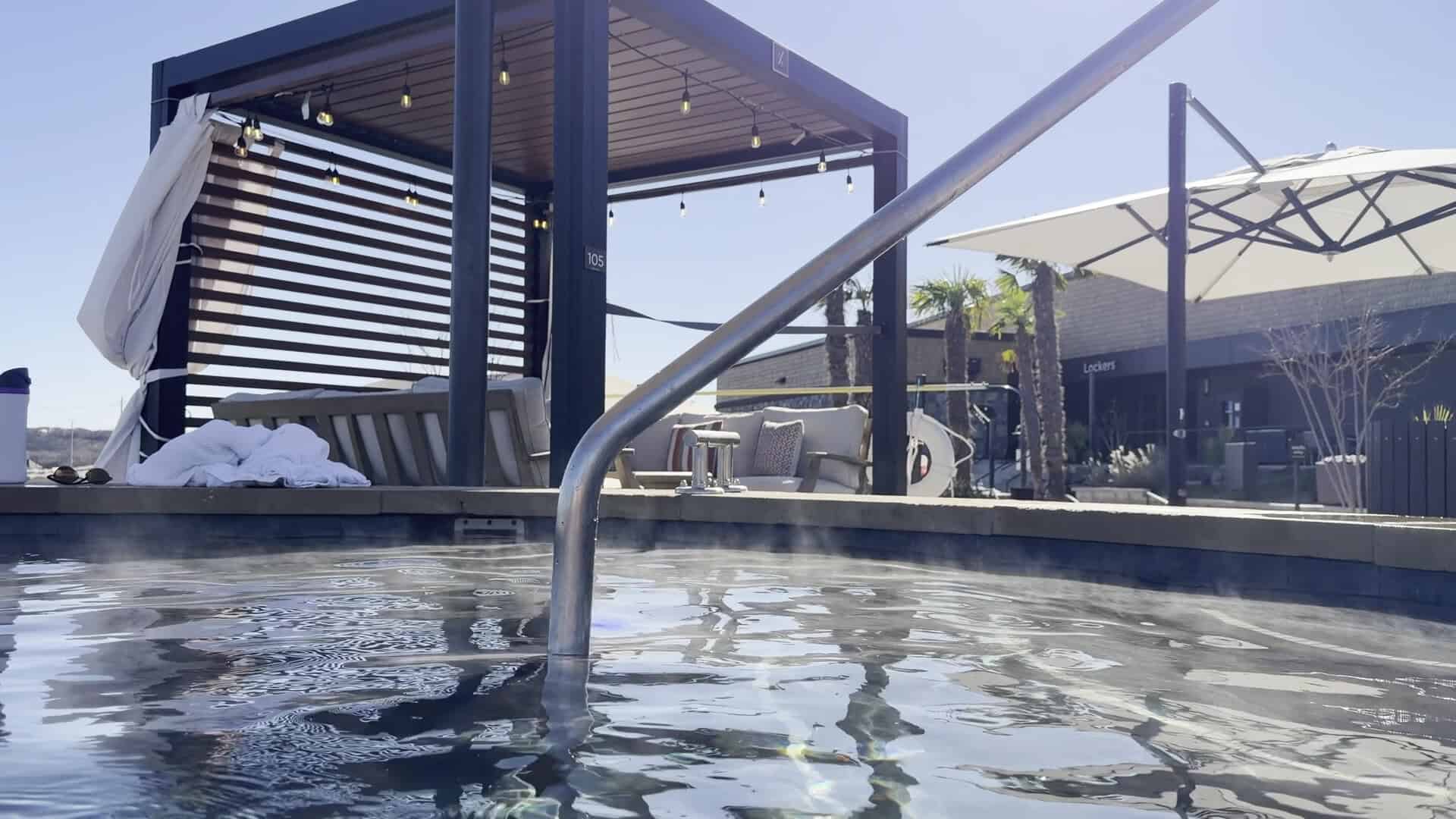 Soaking pool with a shaded pergola and loungers at WorldSprings in The Colony, Texas