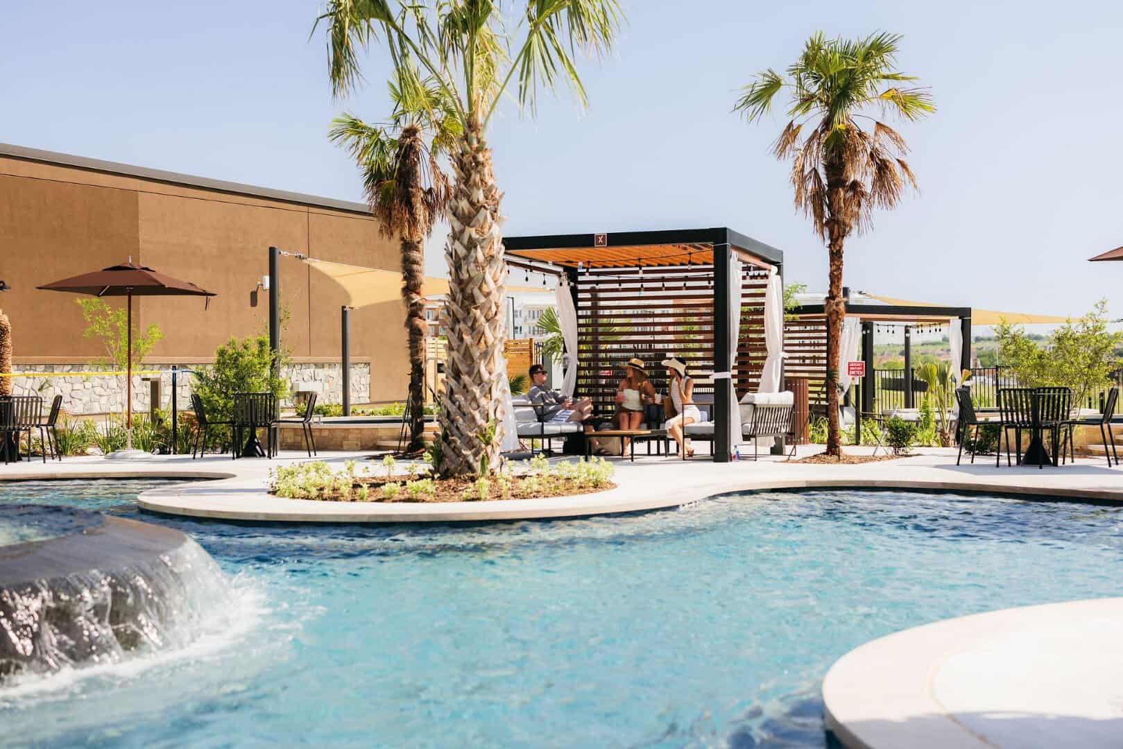 Mineral pool lined with palm trees at WorldSprings in The Colony, Texas