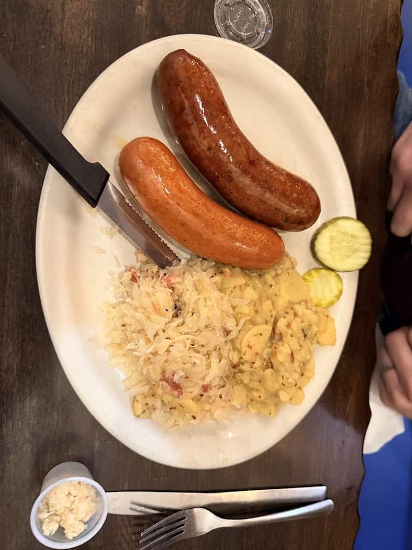 Wurst Teller sausage plate with sauerkraut and German potato salad at Kuby's Sausage House in Dallas