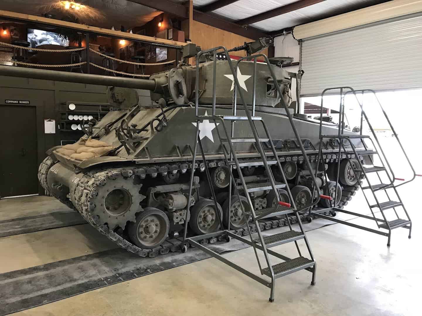 WWII tank with maintenance stairs in the DriveTanks shed in Uvalde, Texas