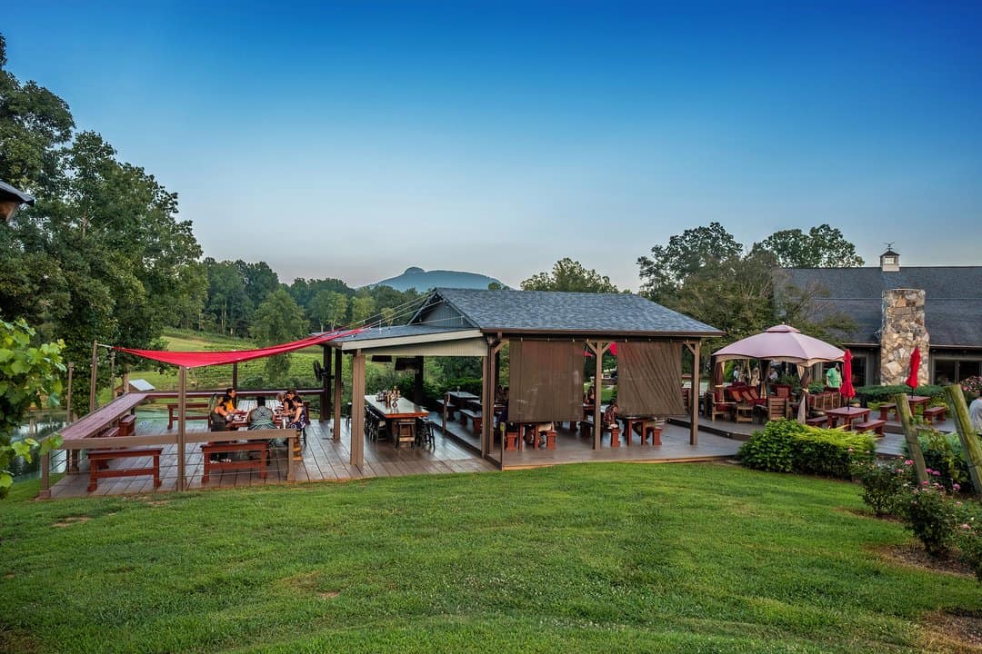 Winery terrace and vineyard below Pilot Mountain in the Yadkin Valley, North Carolina