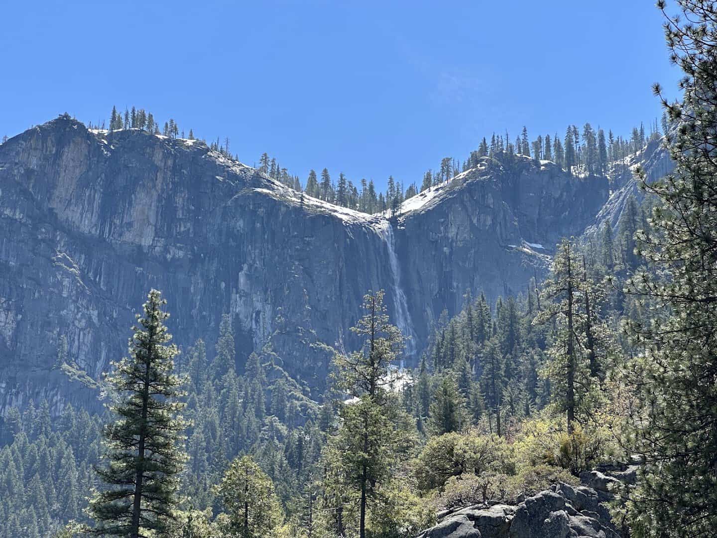 Yosemite Falls with snow on the granite cliffs in winter, Yosemite National Park, California